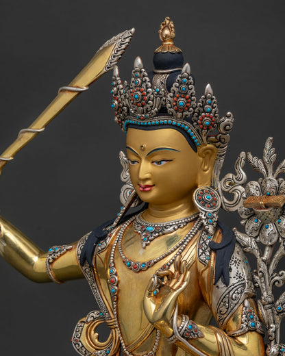 Detailed Side close up of Manjushri Statue showing silver plating and hand engraved details