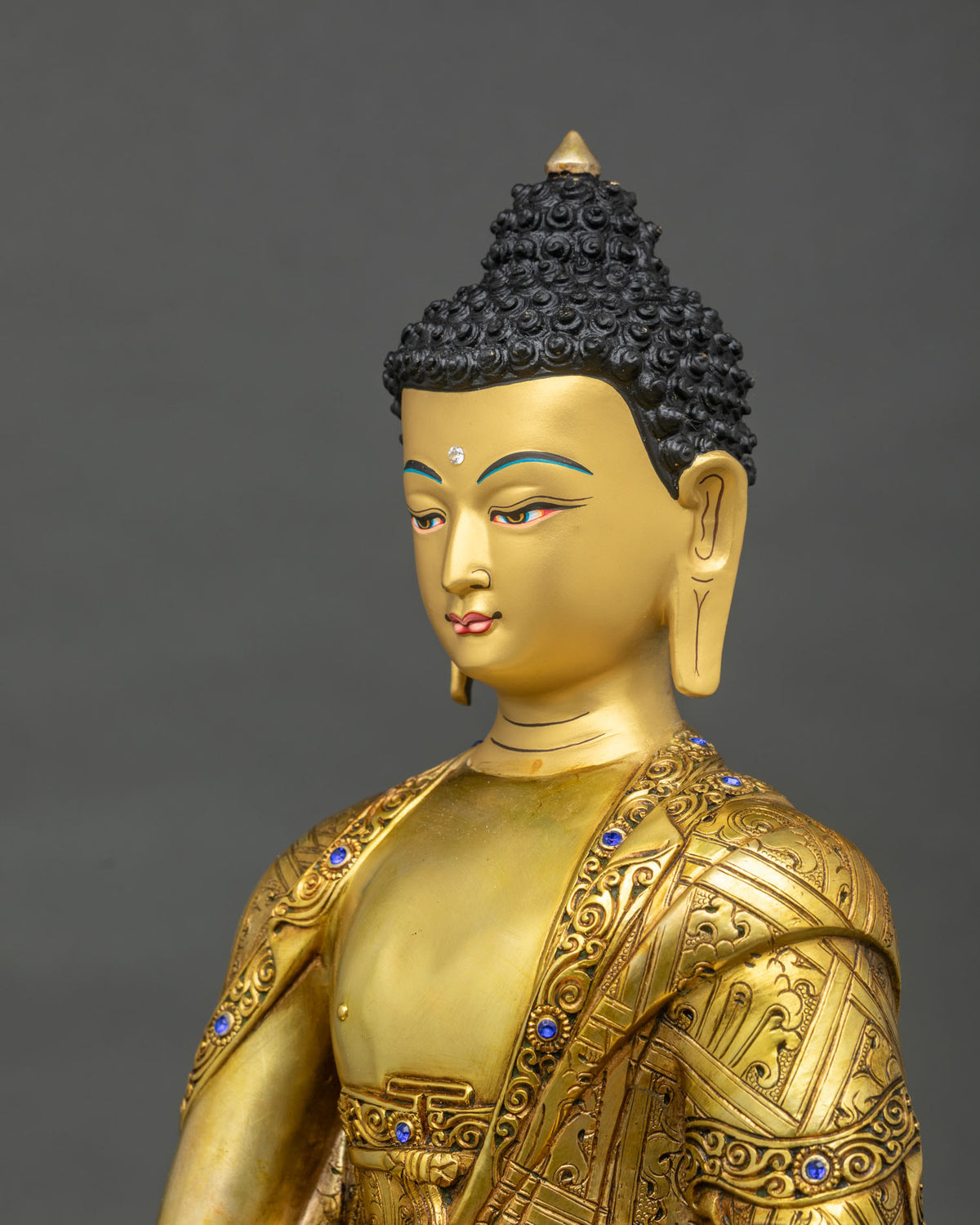 Detailed side close up of Amitabha Buddha statue with hand-carved robe and alms bowl from Nepal