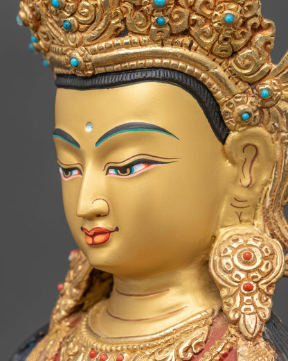 detailed side close up of amitayus statue face showing intricate gold-painted features