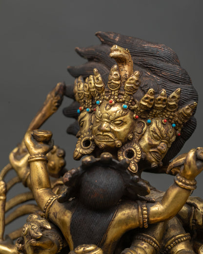 Detailed side close up of antique Hayagriva statue showing hand-carved wings and flame halo