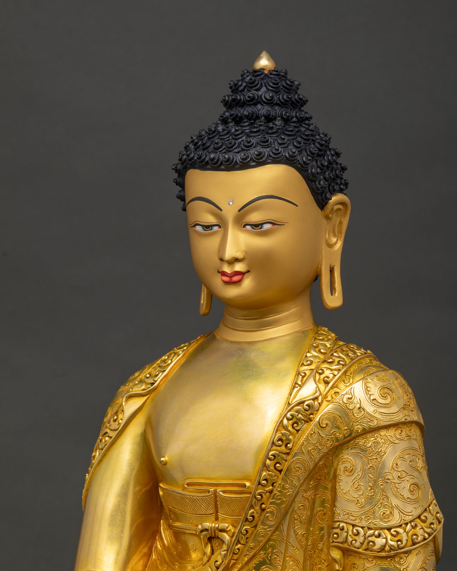 Detailed side close-up of copper Shakyamuni Buddha statue China with repoussé robe