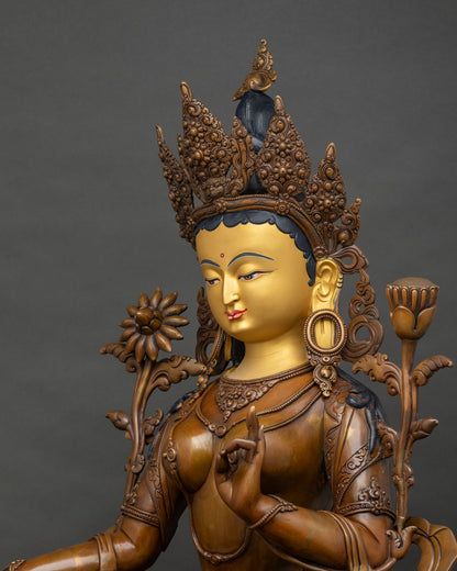 Detailed side close-up of Green Tara statue, flowing garments, finely carved lotus throne