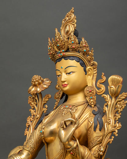 Detailed side close-up of Green Tara statue showing intricate jewelry and 3D carved details