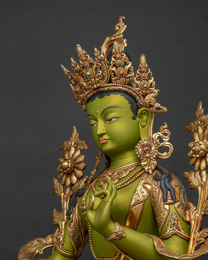 Detailed side close up of Green Tara statue showing ornate jewelry and lotus details