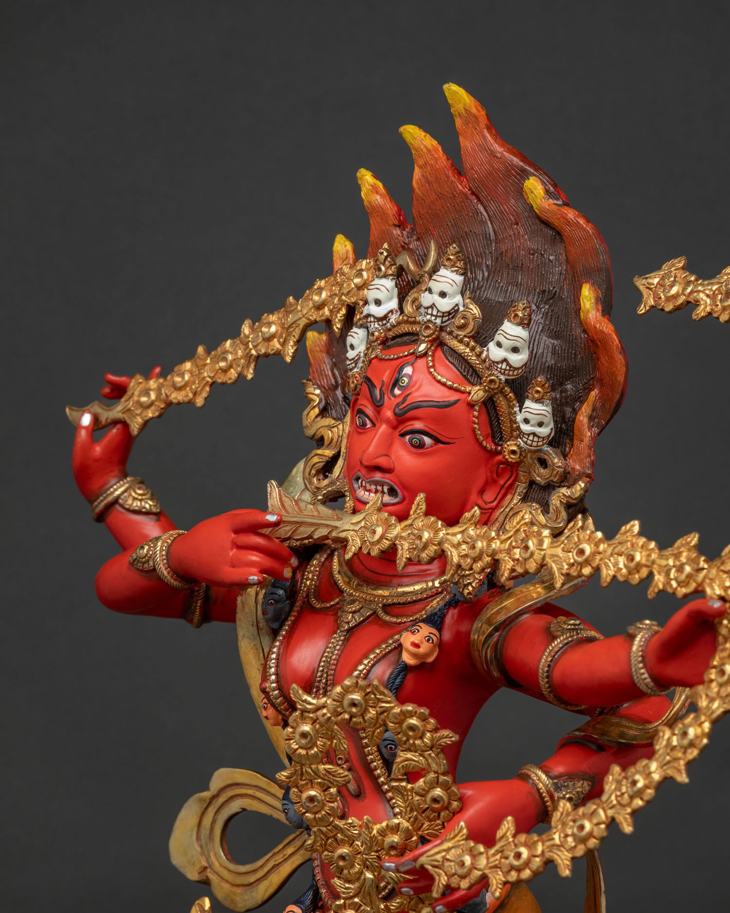 Detailed side close up of Kurukulla Statue, hand-painted acrylic colors, flaming hair, crown of skulls