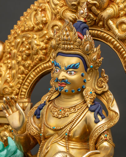Detailed side close up of Namtoshe statue showing jeweled necklaces, flame crown and gilded halo
