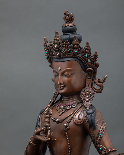 Detailed side close-up of oxidized Vajrasattva statue with carved halo artwork