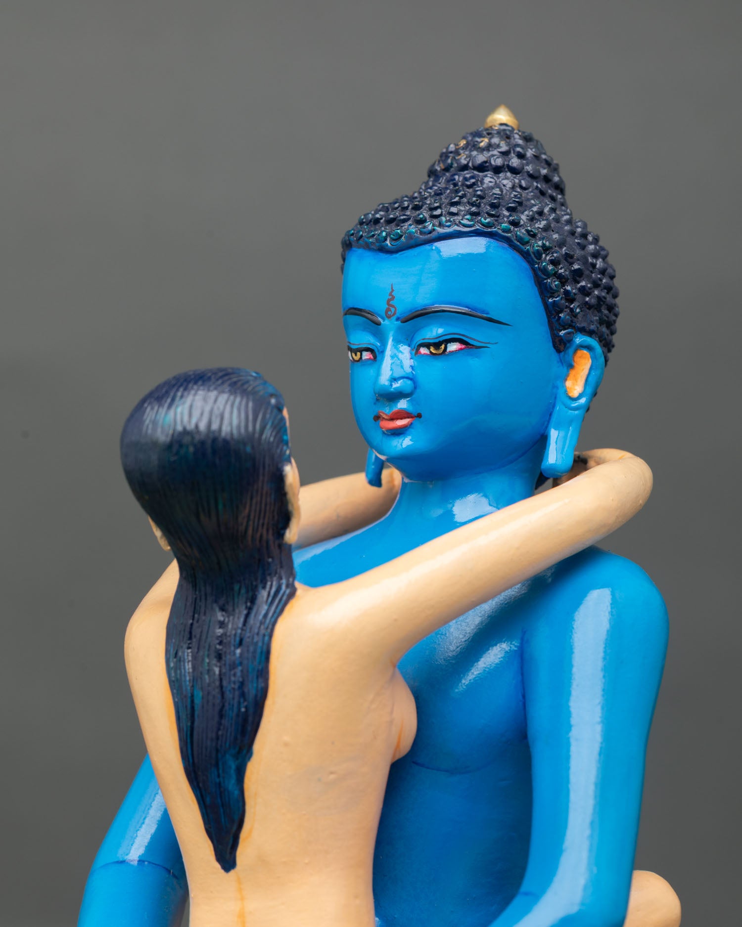 detailed side close up of samantabhadra yab-yum statue with lotus details