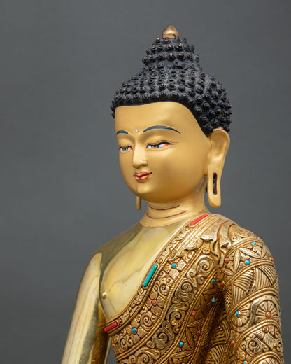 detailed side close up of shakyamuni buddha statue with floral carved robe details