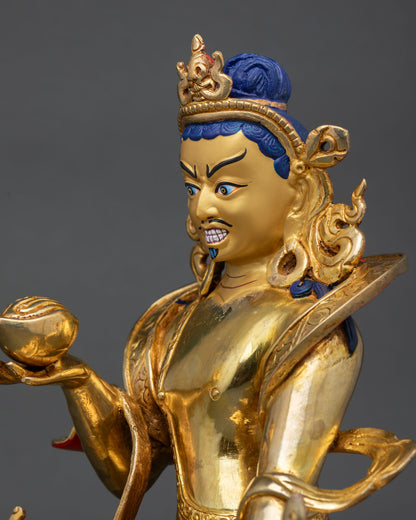 detailed side close up of tilopa statue with engraved robes and flowing scarf motifs