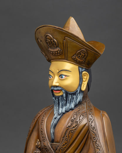Detailed side close-up of zhabdrung rinpoche statue, showcasing copper craftsmanship and oxidized finish