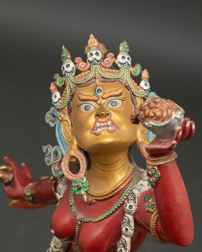 Detailed side close up Vajrayogini statue showing halo trident and refined gold gilded copper craftsmanship