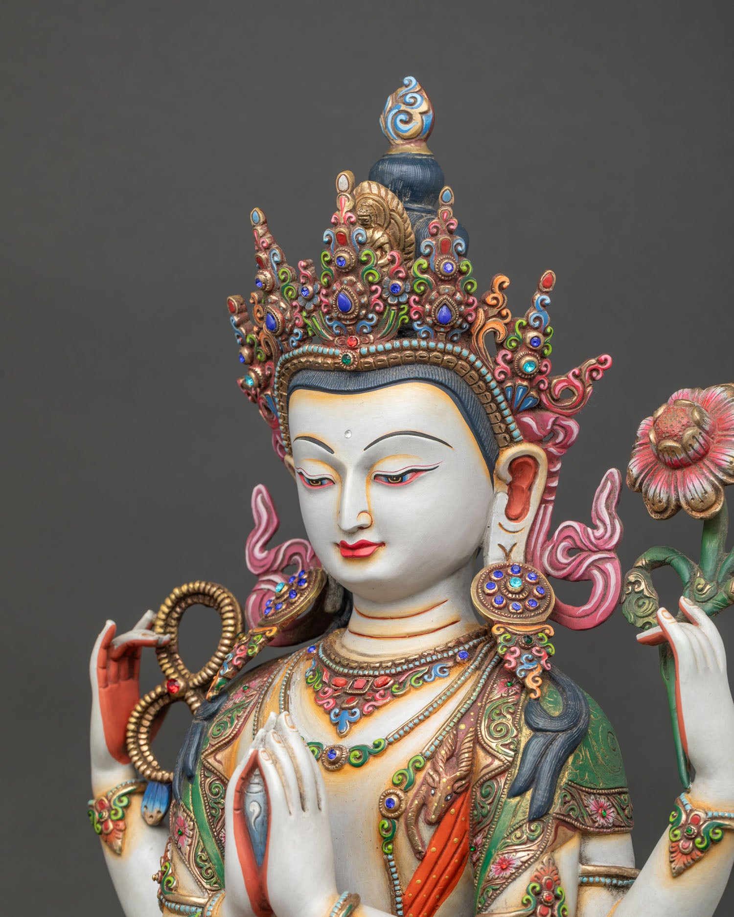Detailed side view of Chenrezig Statue showing gilded ornaments and lotus