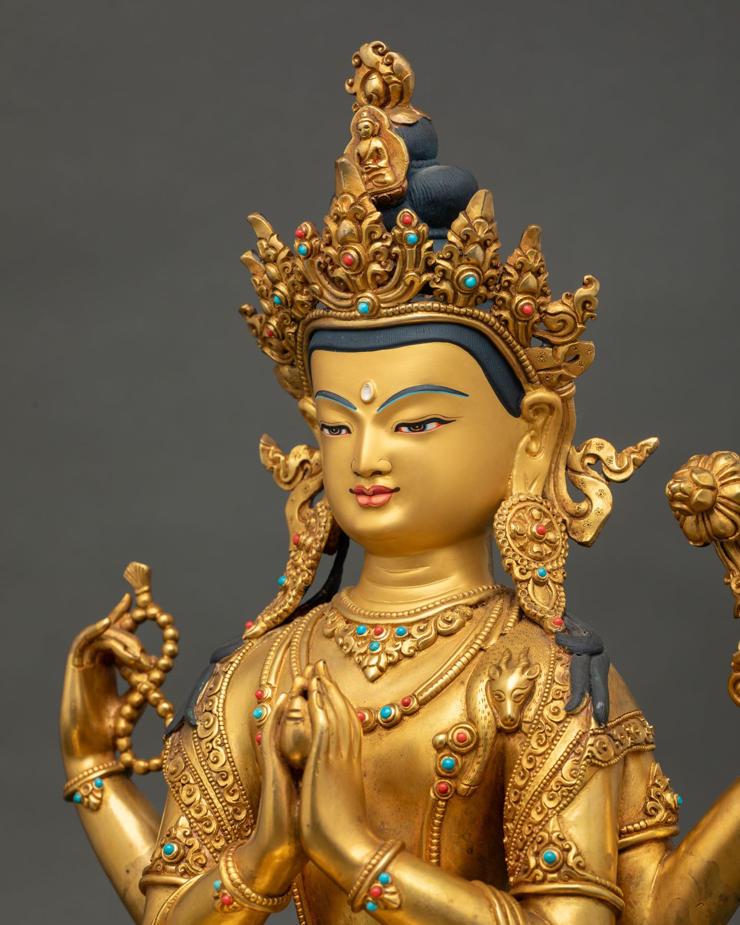Detailed side view of Chenrezig Statue showing lotus, mala, and intricate gold-gilded craftsmanship