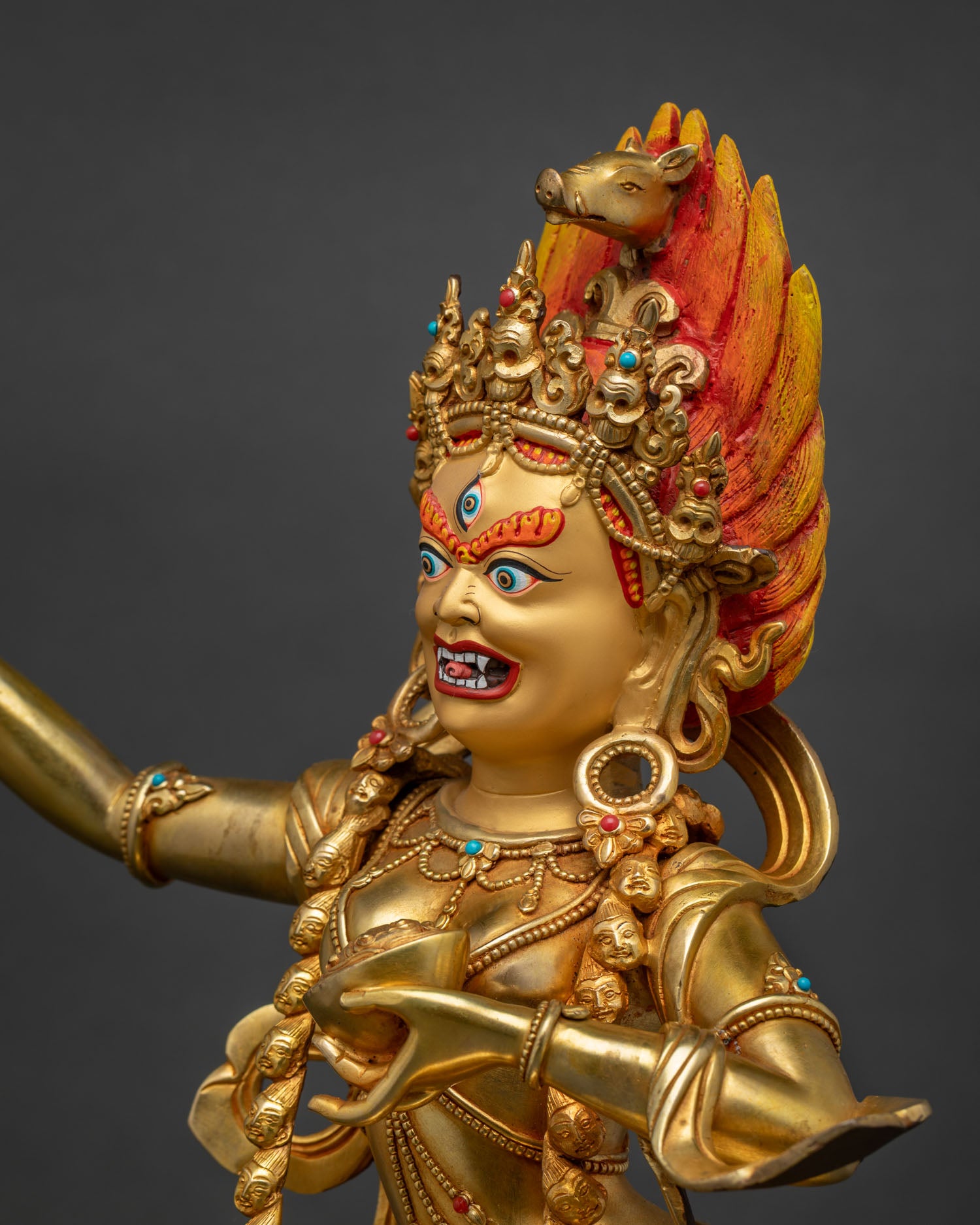 Detailed side view of Dorje Phagmo Statue with trident, flaming halo, and gold-gilded craftsmanship