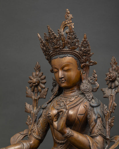 Detailed side view of handcrafted Green Tara copper Buddhist statue