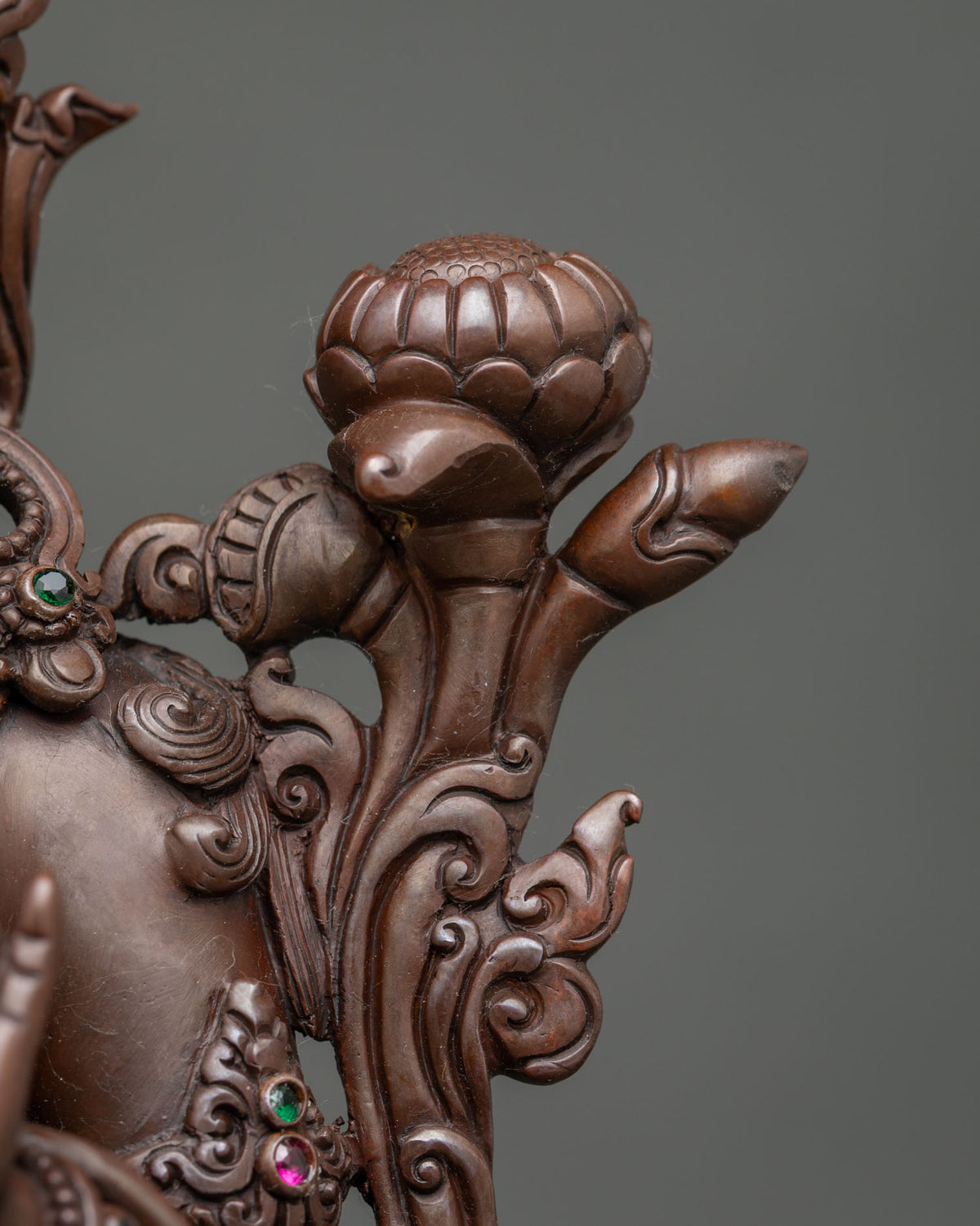 Detailed utpala flower and metalwork on Tibetan Green Tara statue