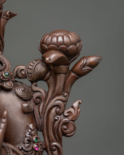 Detailed utpala flower and metalwork on Tibetan Green Tara statue