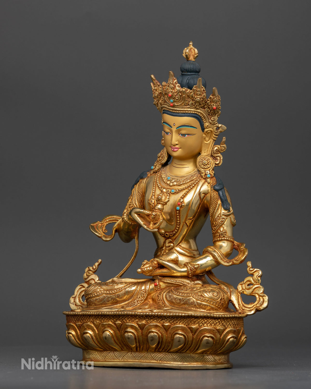 Detailed vajrasattva statue with hand carved silk garment floral motifs and celestial scarf.