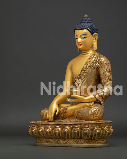Detailed View of Buddha Shakyamuni Statue Showing Floral Engravings and Gold Painted Body