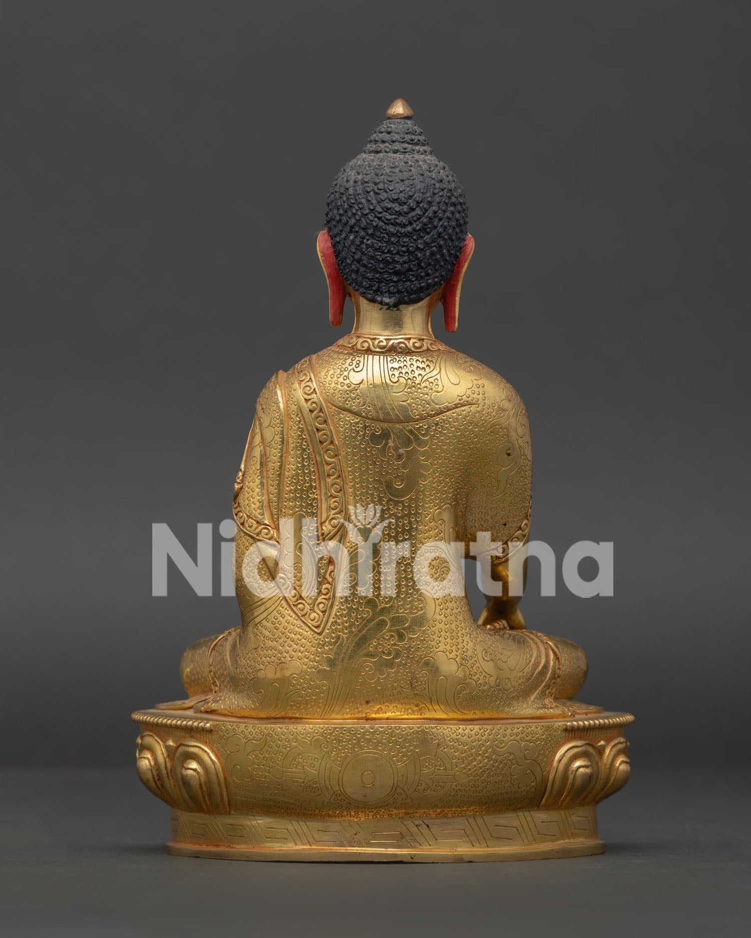 Detailed View of Gold-Gilded Floral Monastic Robe on Shakyamuni Buddha Statue.