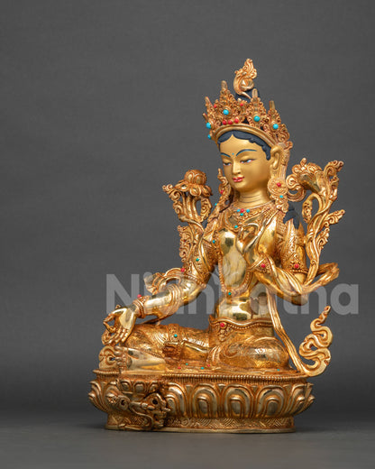 Detailed view of Green Tara Statue with Utpala flowers and hand carved floral details