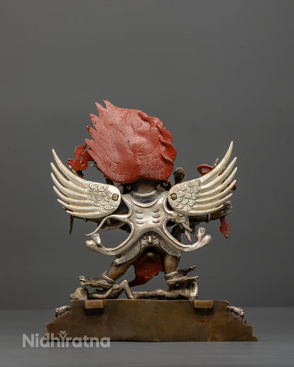 Detailed view of Hayagriva statue with multiple arms and finely carved feathers