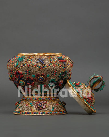 Detailed View of Himalayan Offering Vessel with Engraved Auspicious Symbols and Traditional Craftsmanship
