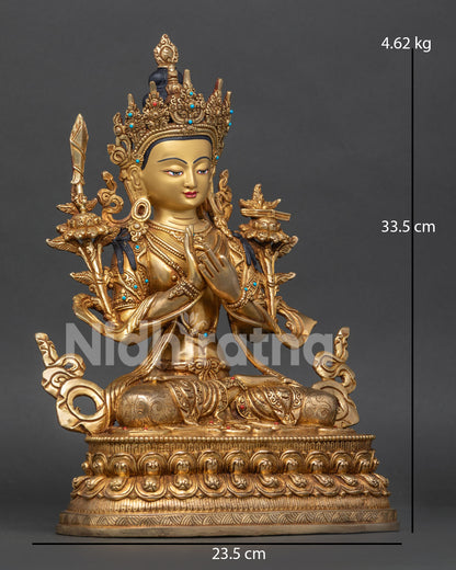 Detailed view of Manjushri Statue with wisdom sword, Prajnaparamita Sutra, and lotus stems in gold gilding