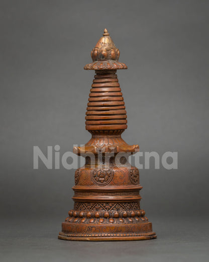 Detailed view of oxidized copper Kadampa Stupa with bell-shaped base and stepped harmika