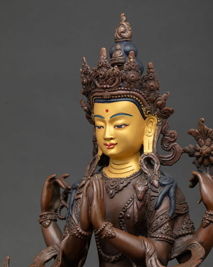 Detailed view of Vajrasattva Buddhist sculpture with sacred ornaments and traditional Himalayan artistry.