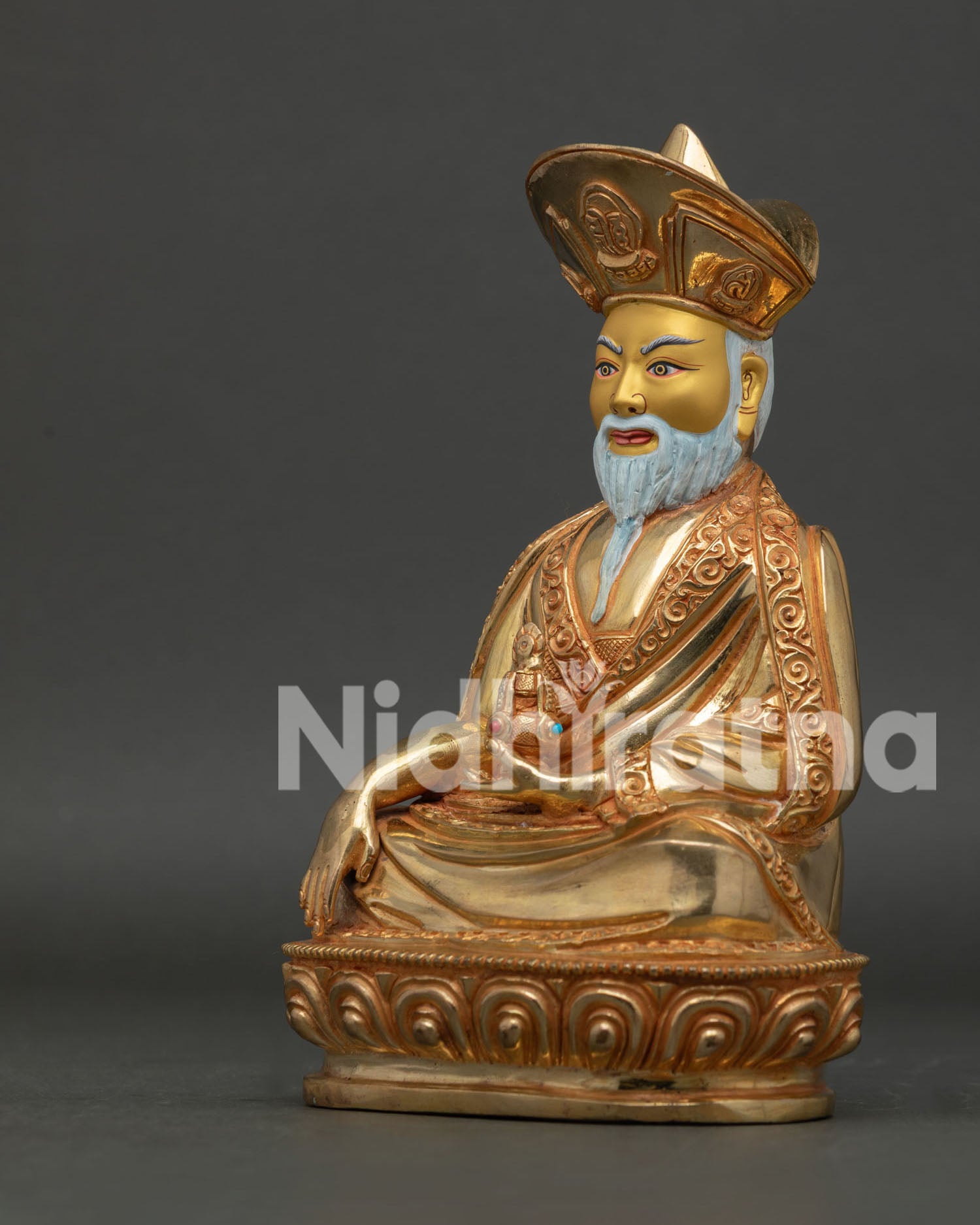 Detailed View of Zhabdrung Rinpoche Statue with White Beard and Monastic Robes.