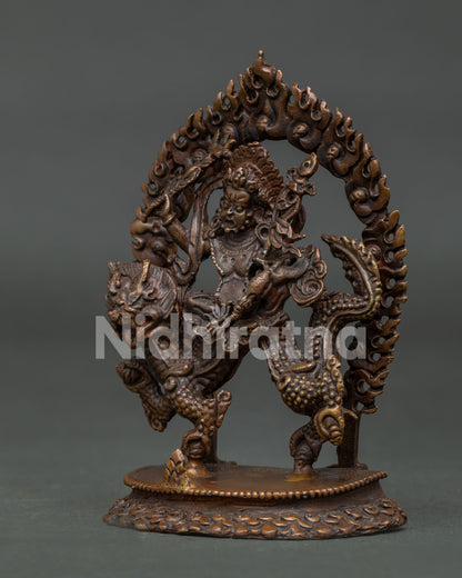 Detailed White Dzambhala statue with oxidized copper finish and dragon.