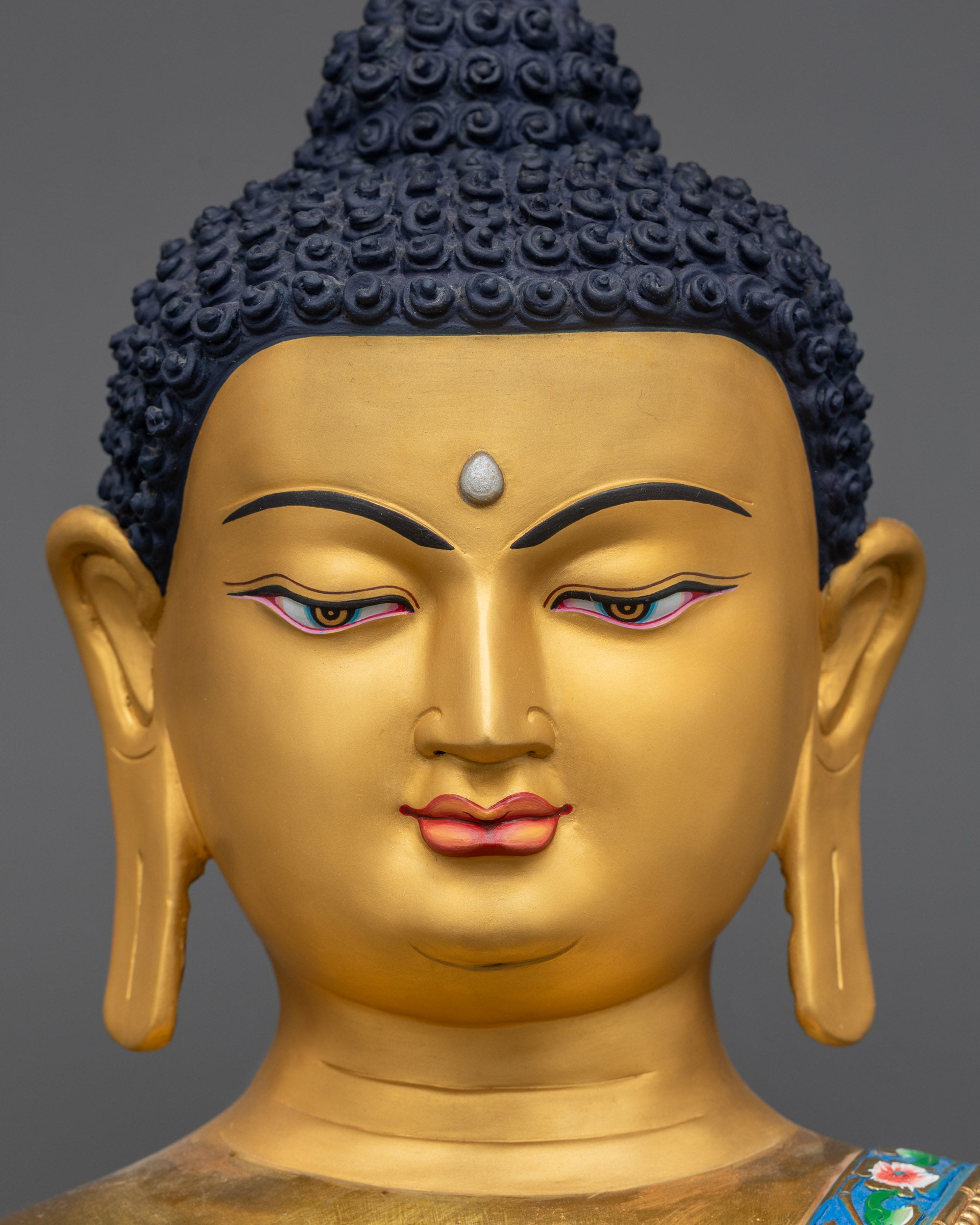 detailed close up face of Shakyamuni Buddha Statue showing serene expression