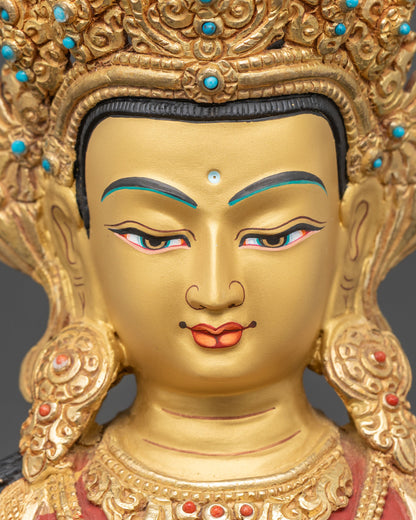 detailed close up of amitayus statue face with gold-gilded jewelry and serene expression