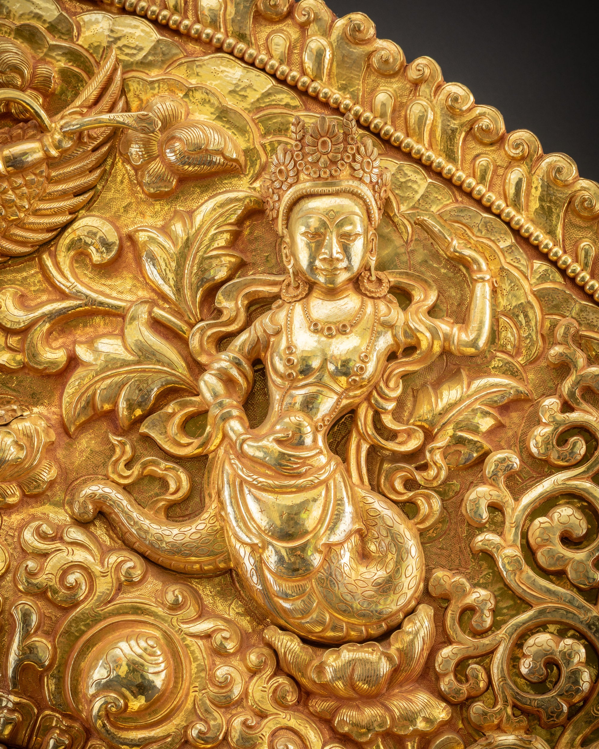 detailed dakini relief carving on Nepalese Buddhist torana throne for deity