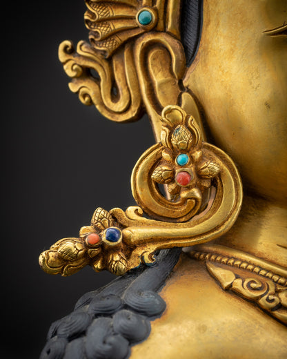 detailed earrings chenrezig statue with jeweled earrings and carvings