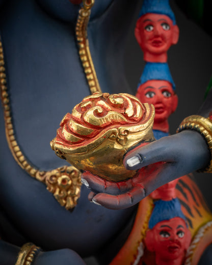 detailed kapala Simha Mukha statue holding skull cup in hand with ornate detailing
