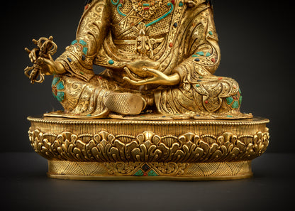detailed landscape shot of guru seated on lotus seat front 24K gold gilded statue Nepal
