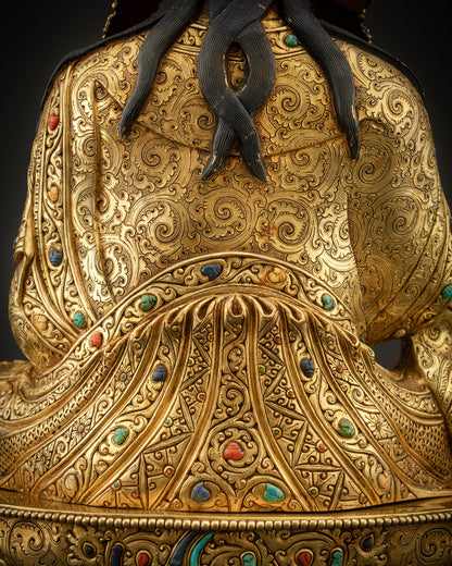 detailed shot of back Padmasambhava Guru Rinpoche statue motifs and copper detailing

