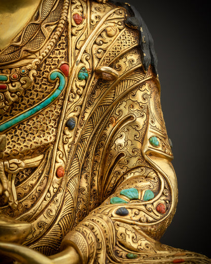 detailed shot of robe and stones Padmasambhava statue semi precious stones Nepal art
