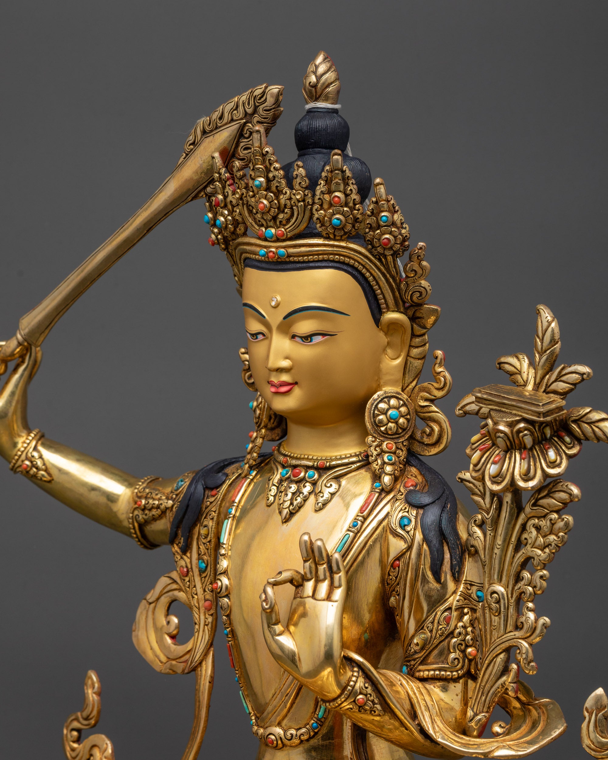 detailed side close up Premium Manjushri Statue on lotus seat with semi-precious stone halo
