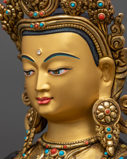 detailed side close up face Chenrezig statue with peaceful gaze, crown and ornate jewelry