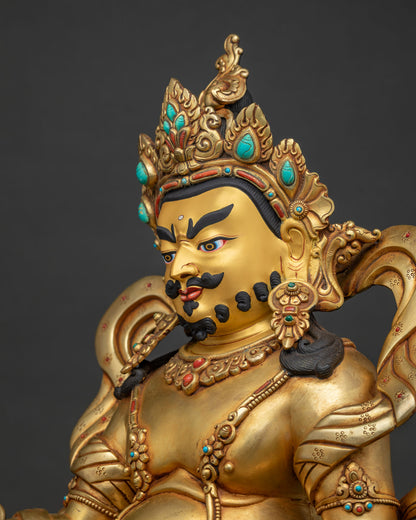 detailed side close up of 24k gold fire-gilded dzambhala statue craftsmanship