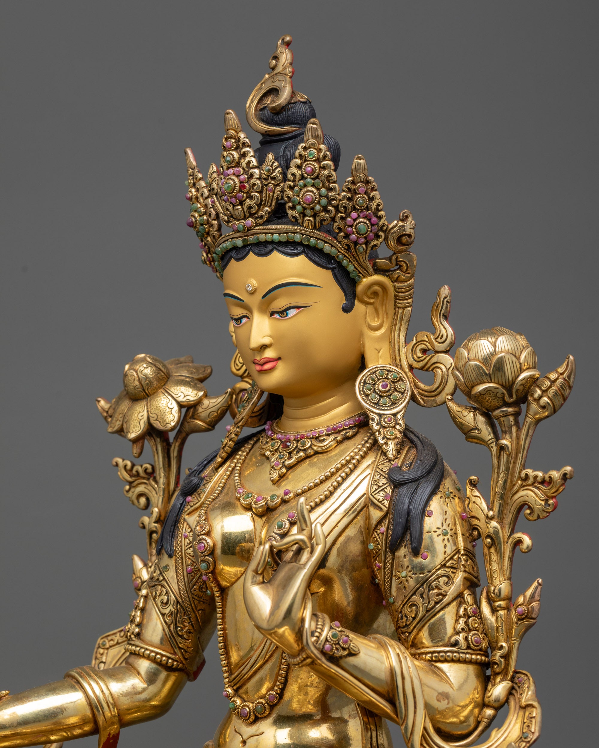 detailed side view Green Tara statue showing lotus stem, flowing robes and halo motifs