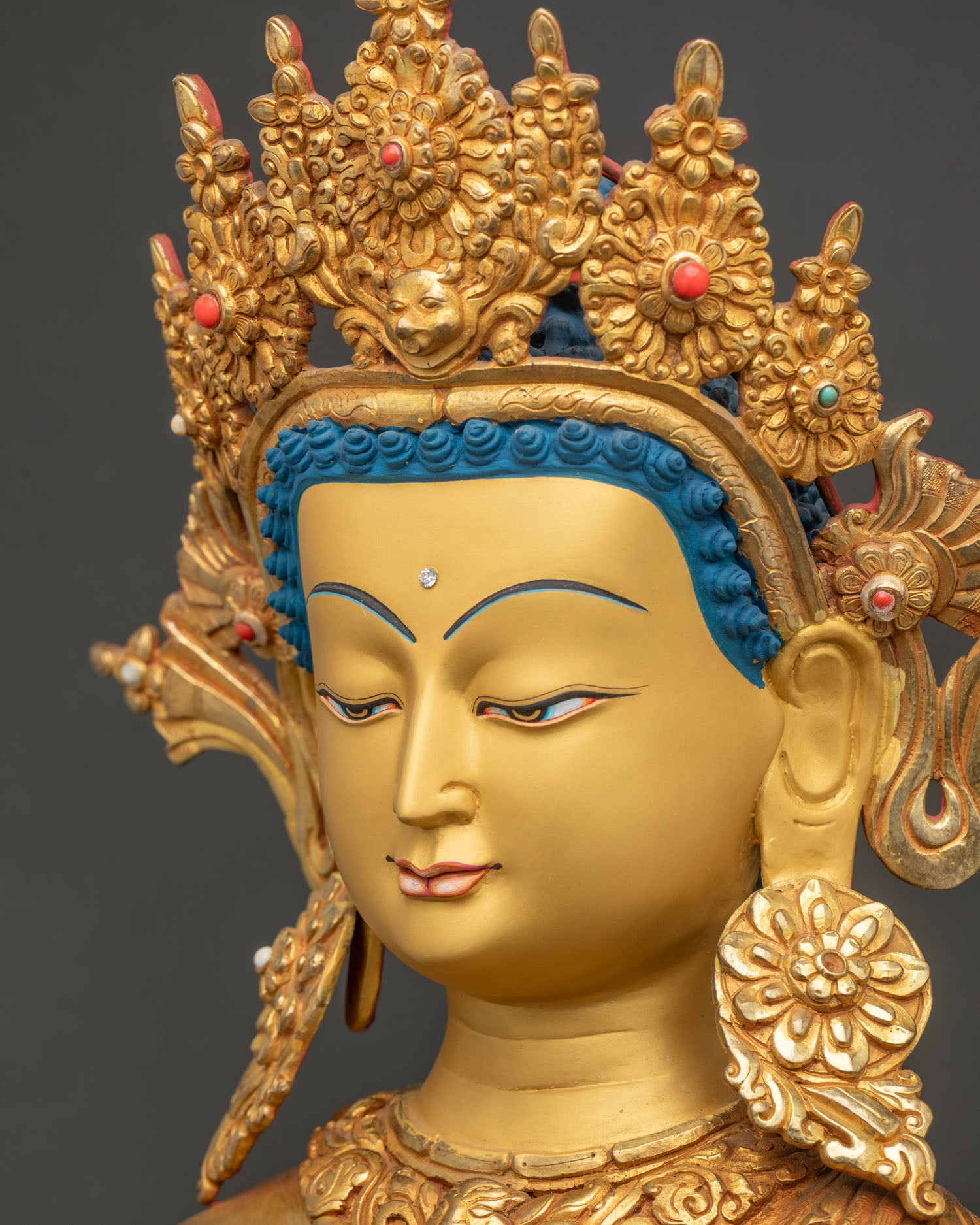 Dipankara Buddha statue detailed side close up face showing crown, earrings and facial details
