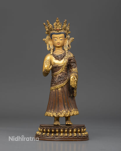 Dipankara Buddha Statue handcrafted by Newari artisans in Patan Nepal featuring an oxidized copper finish and gold gilded details.