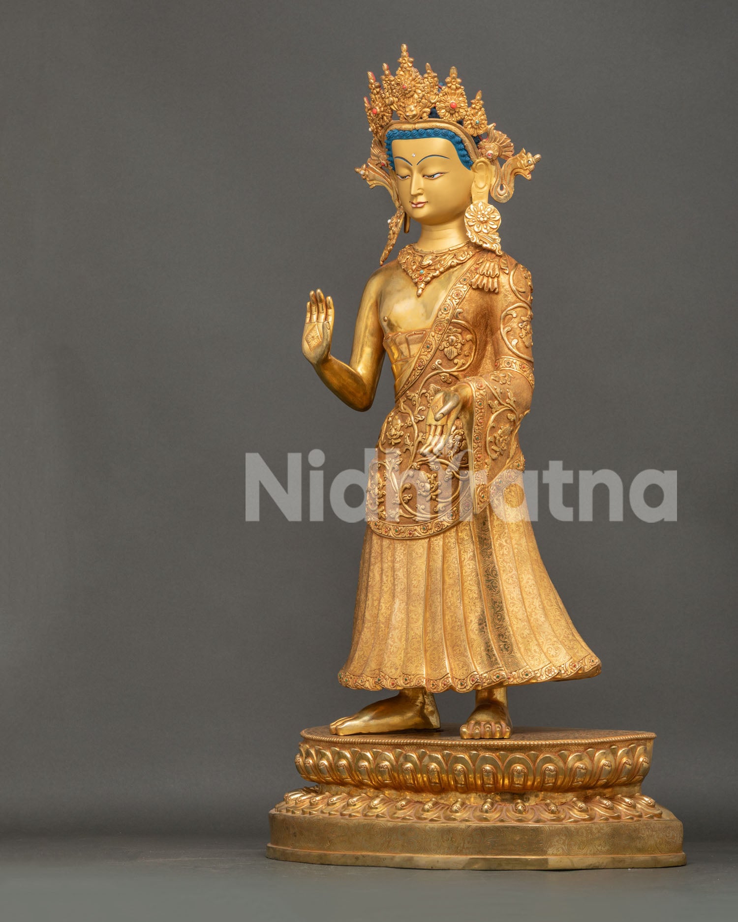 Dipankara Buddha statue left view side showing gold gilding, jewelry and traditional Buddhist artwork