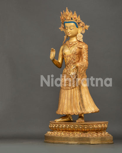 Dipankara Buddha statue left view side showing gold gilding, jewelry and traditional Buddhist artwork