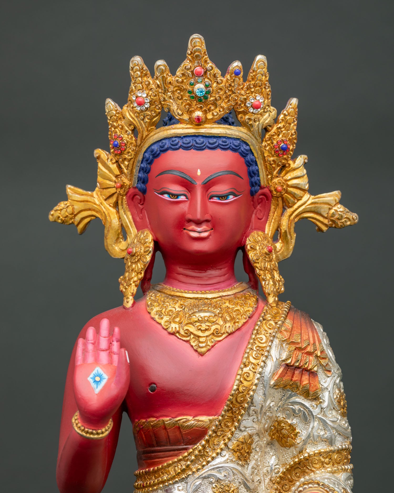 Dipankara Buddha statue with acrylic colors, gemstone decoration